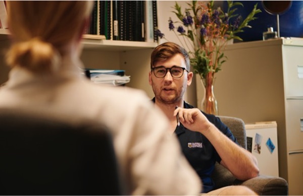 uwa staff member talking to student