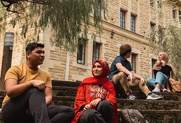 a diverse group of people on the sunken garden steps