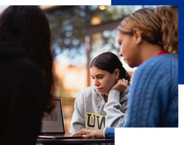 Students sitting around laptop